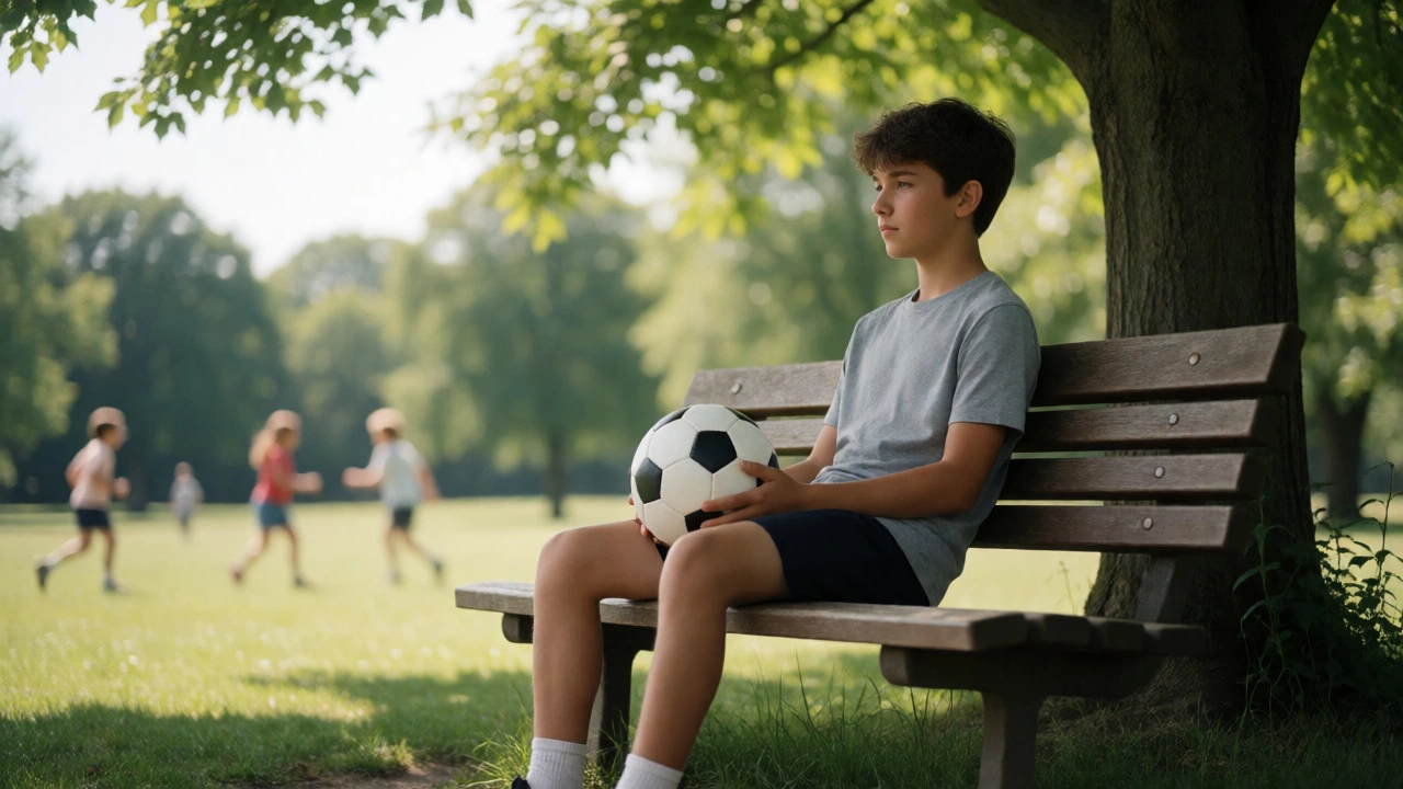 Teenager resting peacefully on a park bench with a soccer ball